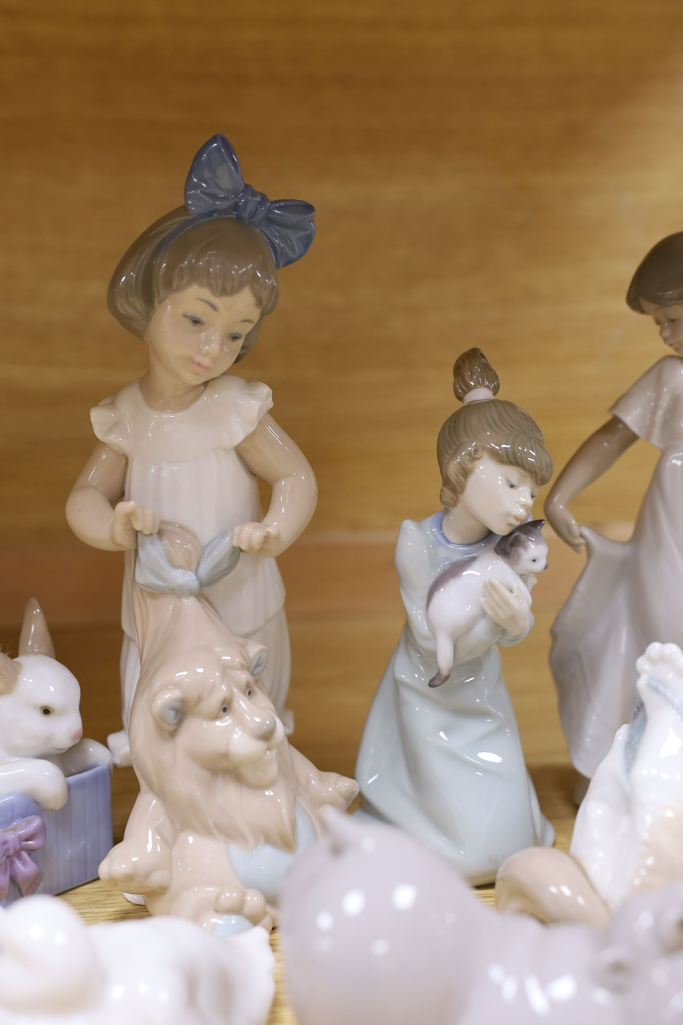 A selection of Lladro and Nao figures